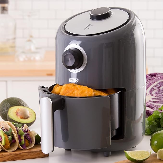 Dash Compact Air Fryer in aqua blue color with basket partially pulled out.