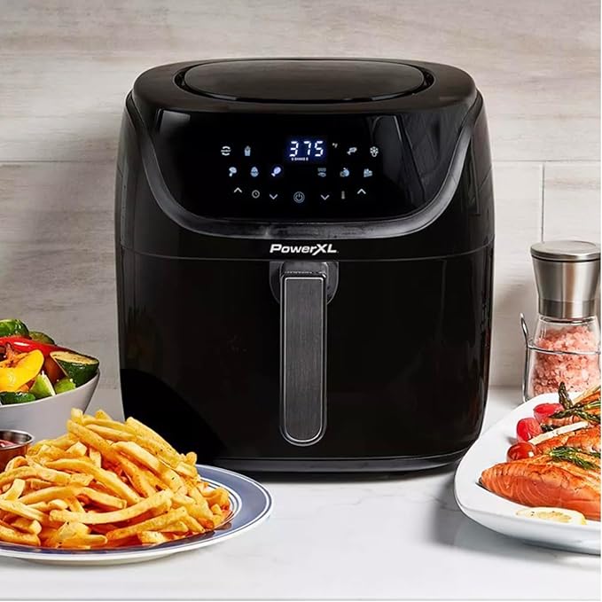 PowerXL Air Fryer Pro Plus oven-style air fryer with racks and rotisserie spit shown.